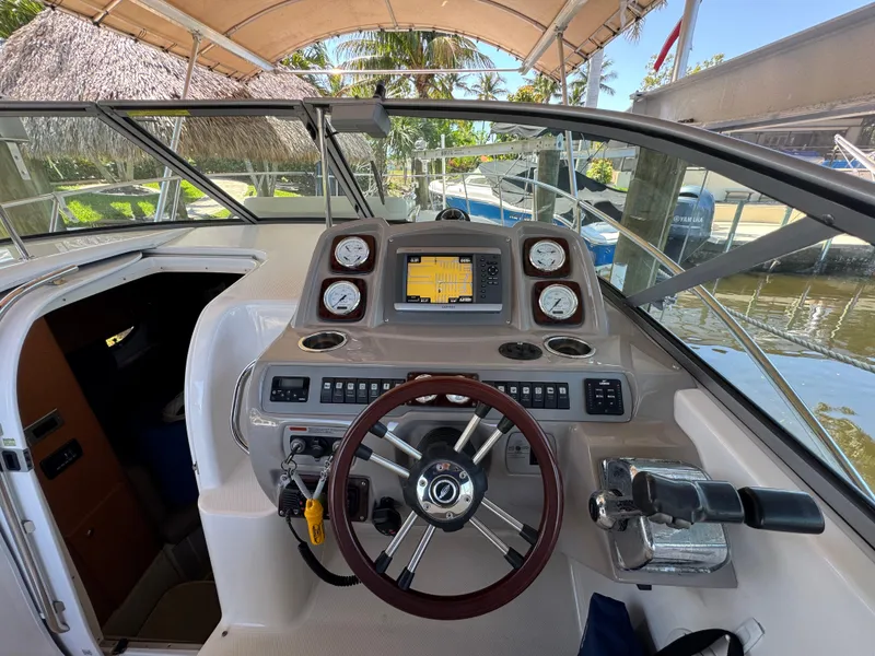 Slide: The Image of 2009 Chaparral Signature 290 boat cockpit with steering wheel and navigation controls. - 4