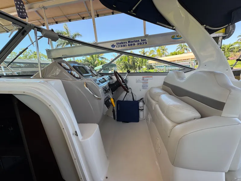 Slide: The Image of 2009 Chaparral Signature 290 boat interior with helm and seating area. - 6