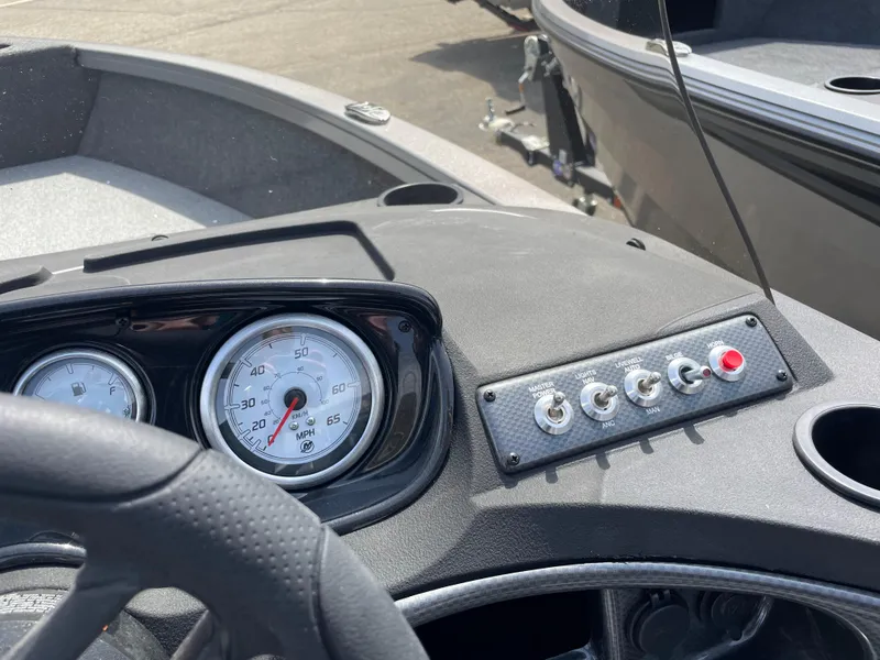 Slide: The Image of Dashboard of 2025 Crestliner 1750 Hawk SC boat with gauges and controls. - 11