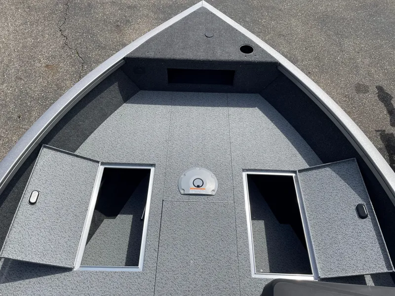 Slide: The Image of 2025 Crestliner 1750 Hawk SC boat deck with storage compartments open. - 14