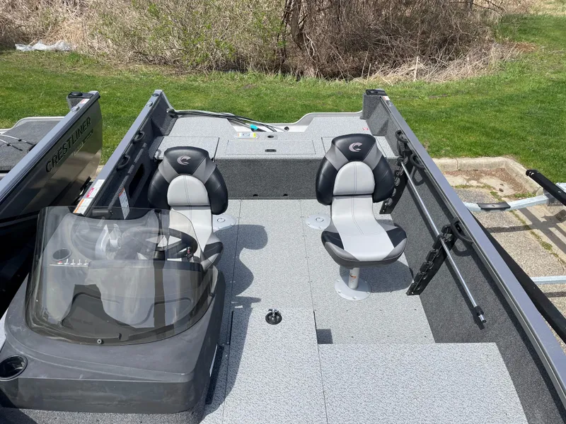 Slide: The Image of 2025 Crestliner 1750 Hawk SC boat interior with two seats and steering console. - 15