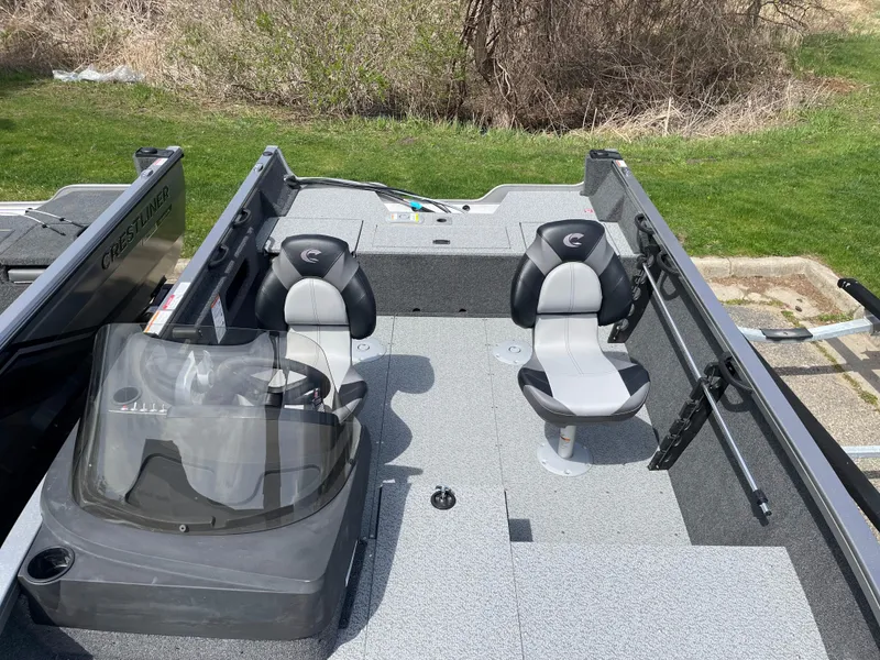 Slide: The Image of 2025 Crestliner 1750 Hawk SC boat interior with two seats and steering console. - 16