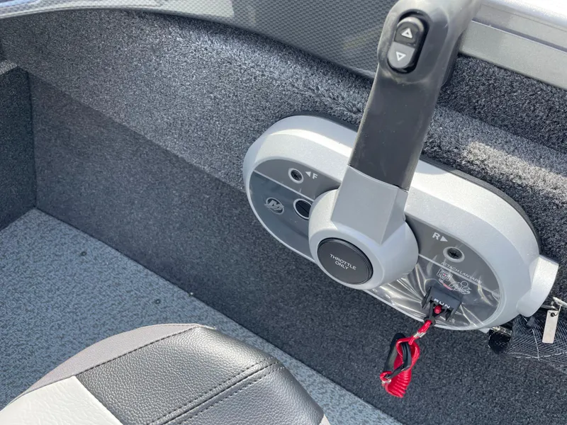 Slide: The Image of 2025 Crestliner 1750 Hawk SC boat control panel with throttle lever and key. - 18