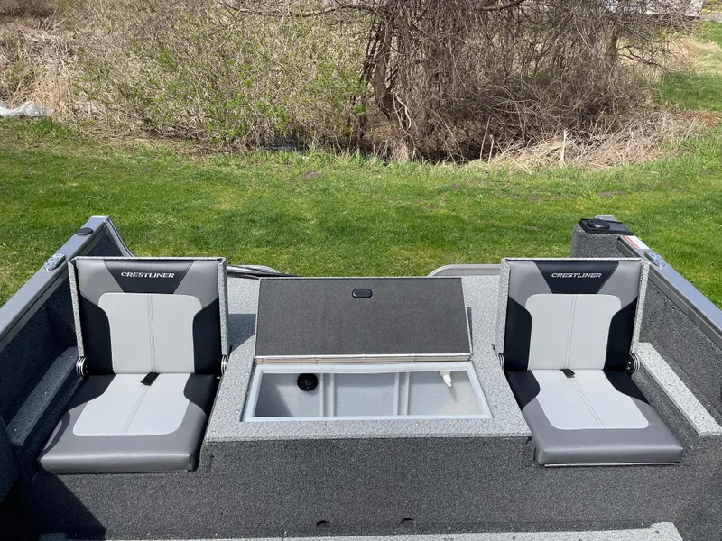 Slide: The Image of 2025 Crestliner 1750 Hawk SC boat interior with two seats and storage compartment. - 3