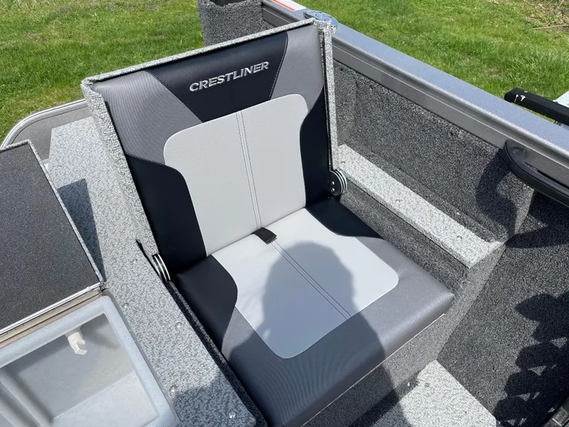 Slide: The Image of Crestliner 1750 Hawk SC 2025 boat seat, gray and black design, outdoor setting. - 6