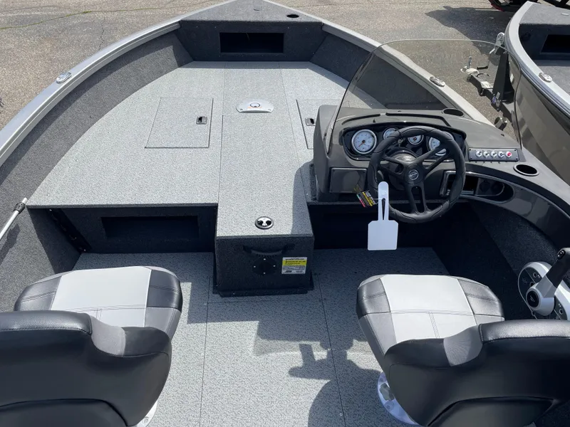 Slide: The Image of 2025 Crestliner 1750 Hawk SC boat interior with dual seats and steering console. - 9