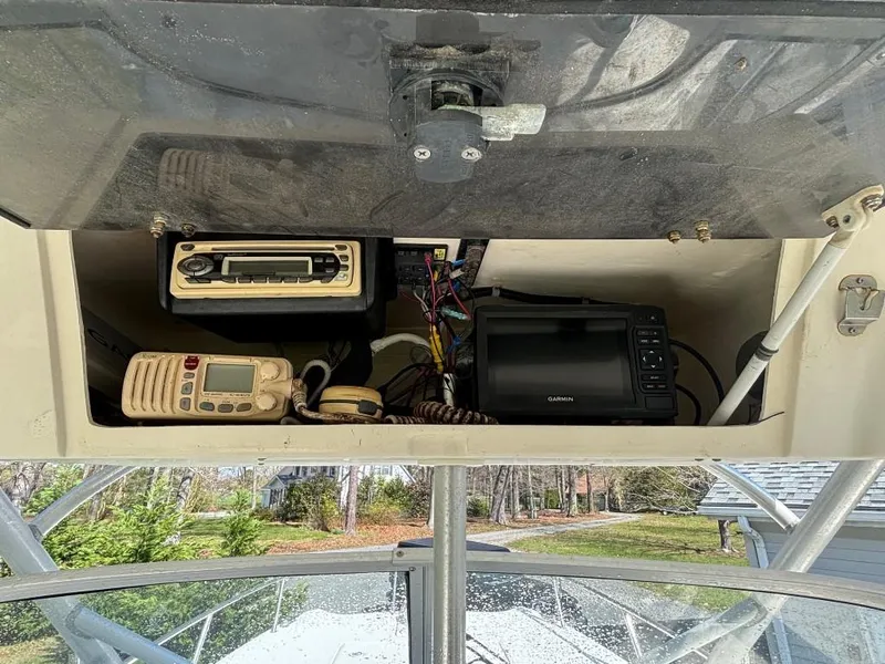Slide: The Image of 2001 World Cat 266 SC boat dashboard with radio, GPS, and communication equipment. - 4