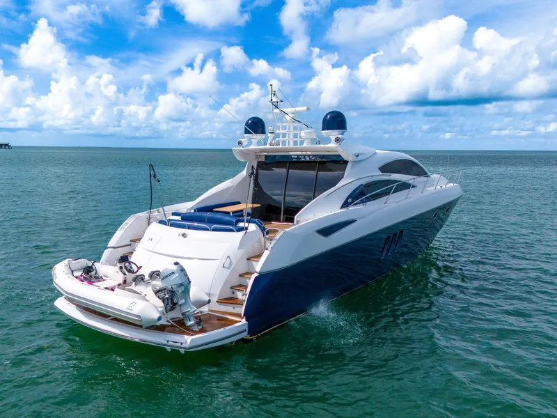 Slide: The Image of Luxurious 2006 Sunseeker Predator 72 yacht cruising on open water under a clear sky. - 12