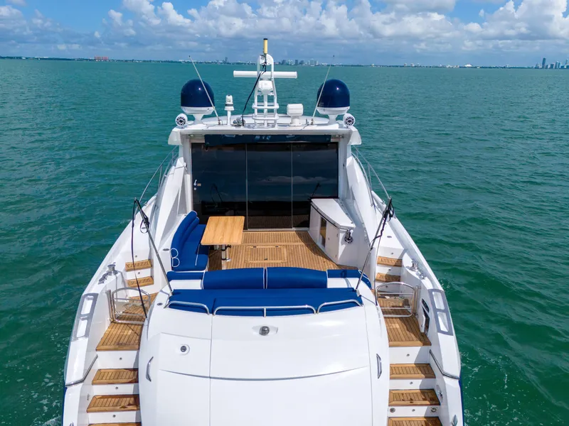 Slide: The Image of Sunseeker Predator 72 yacht, 2006 model, cruising on open water under a clear sky. - 14