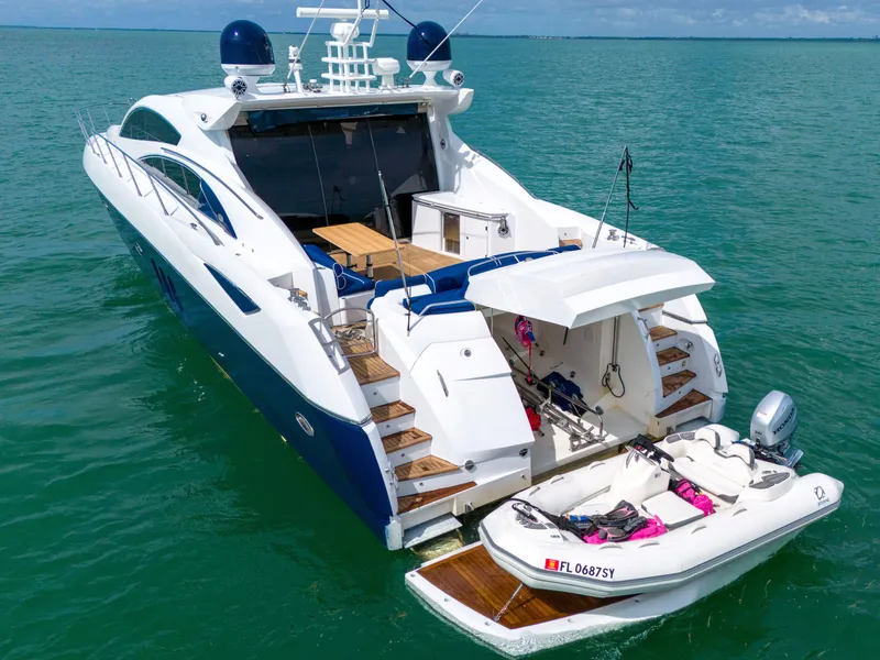 Slide: The Image of Luxury Sunseeker Predator 72 yacht, 2006 model, with tender in turquoise waters. - 17