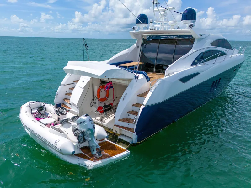 Slide: The Image of 2006 Sunseeker Predator 72 yacht with tender in open sea. - 18