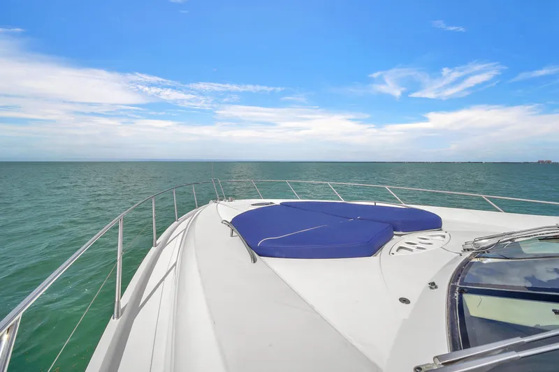 Slide: The Image of Sunseeker Predator 72 yacht deck view, 2006 model, cruising on open sea under blue sky. - 19