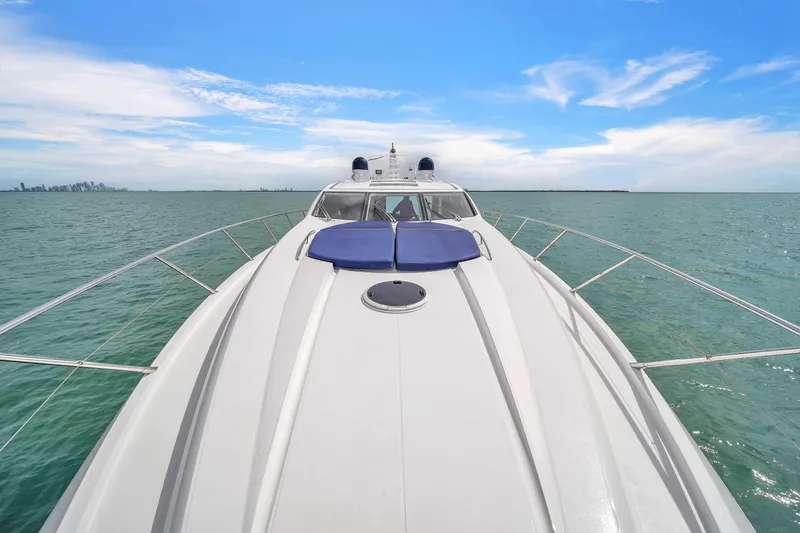 Slide: The Image of Sunseeker Predator 72 yacht cruising on open sea under clear blue sky, 2006 model. - 20