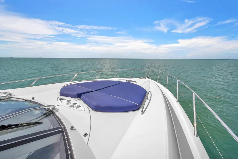 Slide: The Image of Sunseeker Predator 72 yacht deck view, 2006 model, on open sea under blue sky. - 21