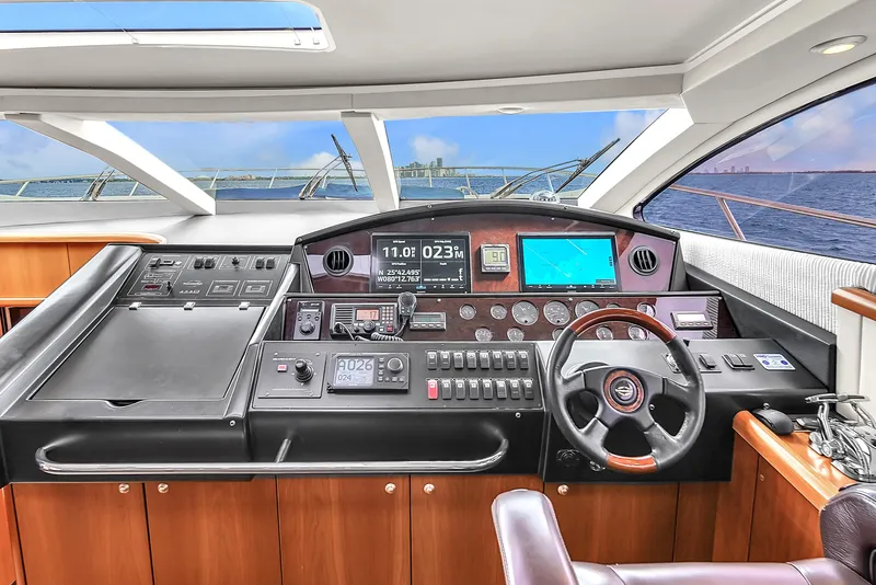 Slide: The Image of Cockpit of 2006 Sunseeker Predator 72 yacht with modern navigation equipment and ocean view. - 36