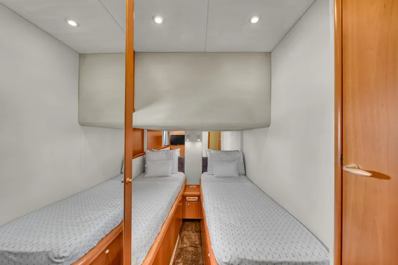 Slide: The Image of Twin cabin interior of 2006 Sunseeker Predator 72 yacht, featuring modern design and cozy bedding. - 41