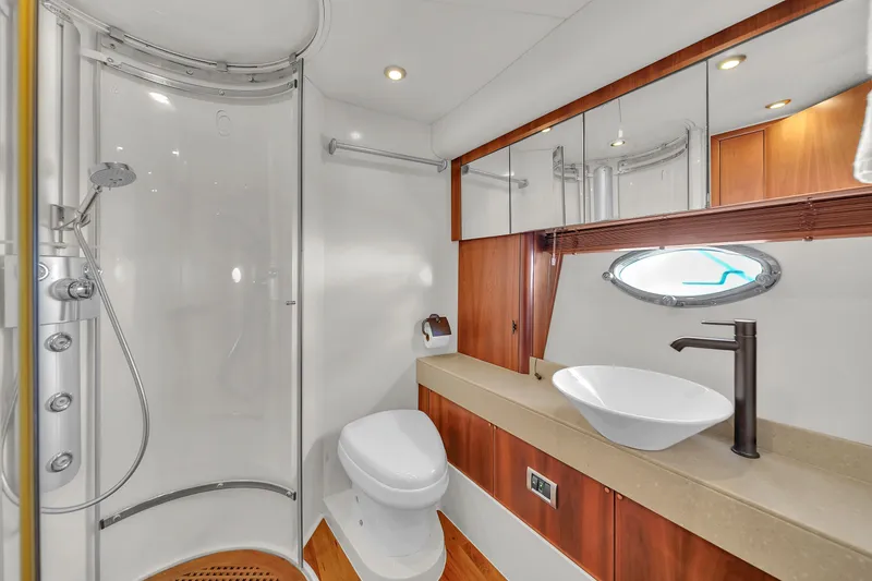 Slide: The Image of Luxurious bathroom in 2006 Sunseeker Predator 72 yacht with modern fixtures and elegant design. - 43