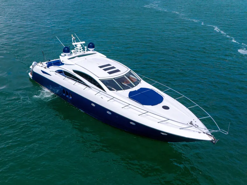 Slide: The Image of Sunseeker Predator 72 yacht cruising on open water, 2006 model, sleek design. - 5