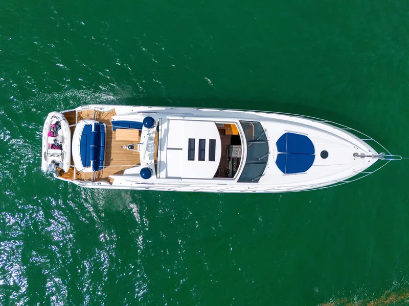 Slide: The Image of Aerial view of 2006 Sunseeker Predator 72 yacht on green water. - 7