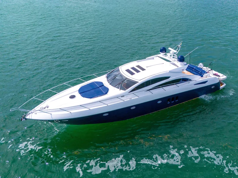 Slide: The Image of 2006 Sunseeker Predator 72 yacht cruising on open water. - 9