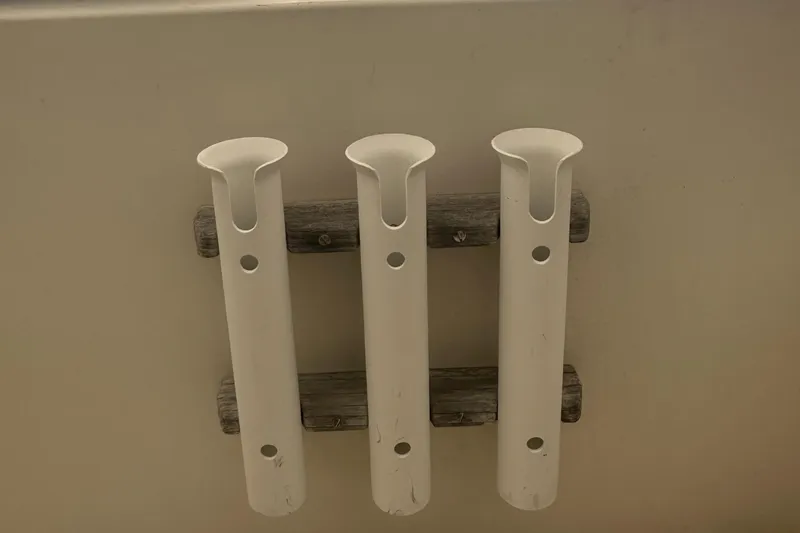Slide: The Image of Three white rod holders on a Grady-White Tournament 170 boat, 1983 model. - 4