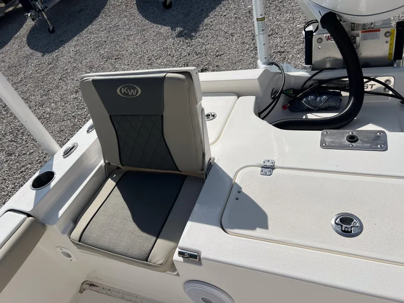 Slide: The Image of 2025 Key West 250 Bay Reef boat seat and deck, featuring sleek design and modern amenities. - 14