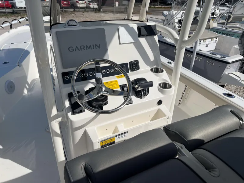 Slide: The Image of 2025 Key West 250 Bay Reef boat console with Garmin navigation system and steering wheel. - 17