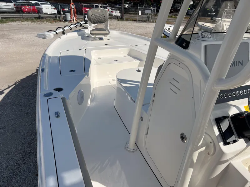 Slide: The Image of 2025 Key West 250 Bay Reef boat interior with seating and control panel. - 20