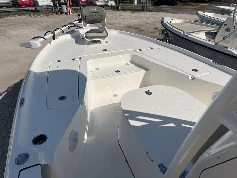 Slide: The Image of 2025 Key West 250 Bay Reef boat interior with seating and storage compartments. - 21