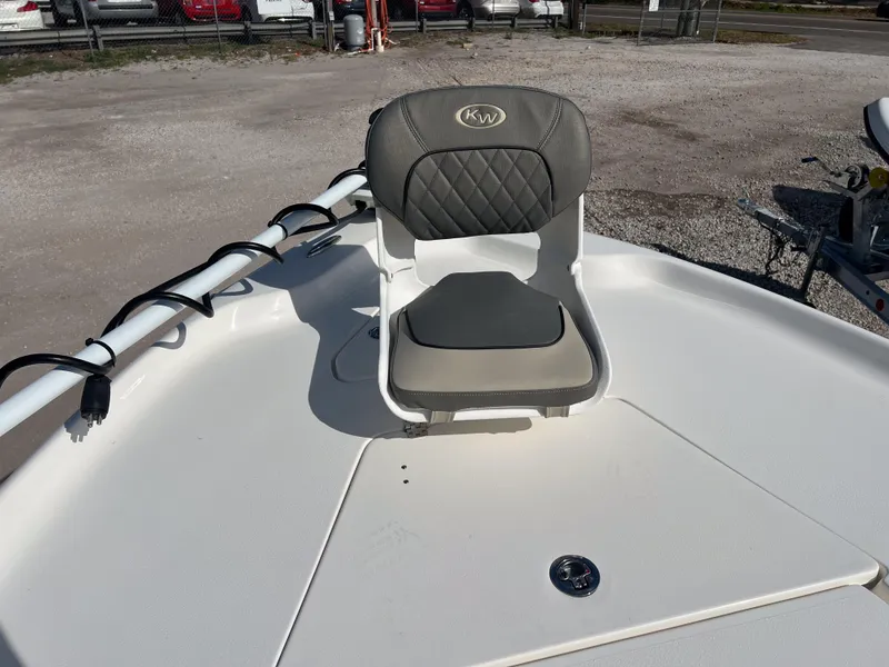 Slide: The Image of 2025 Key West 250 Bay Reef boat with cushioned seating on deck. - 22