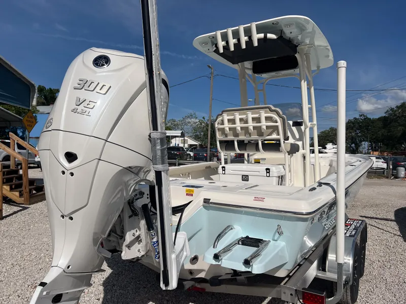 Slide: The Image of 2025 Key West 250 Bay Reef boat with powerful 300 V6 engine, parked outdoors. - 4