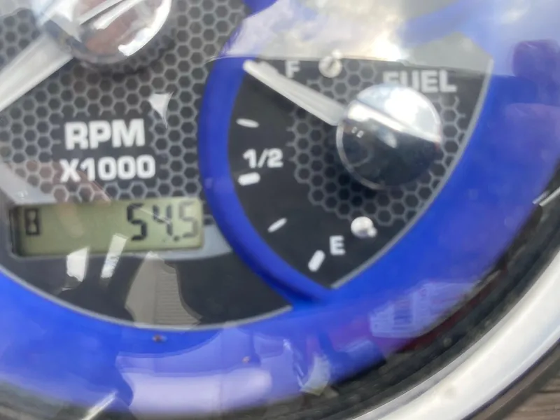 Slide: The Image of Close-up of a 2022 Premier 210 Sunsation RL dashboard showing RPM and fuel gauge. - 14