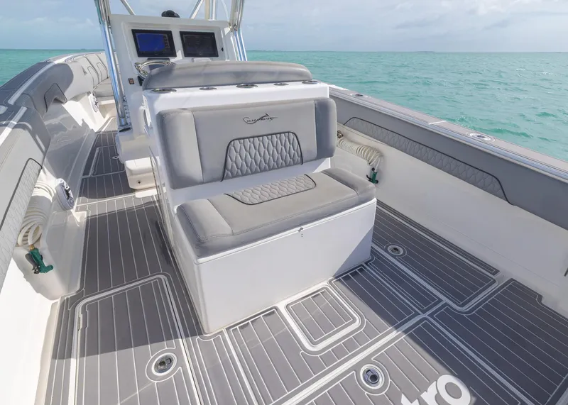 Slide: The Image of 2021 Blackwater 36 Sport boat interior with gray seating and ocean view. - 13