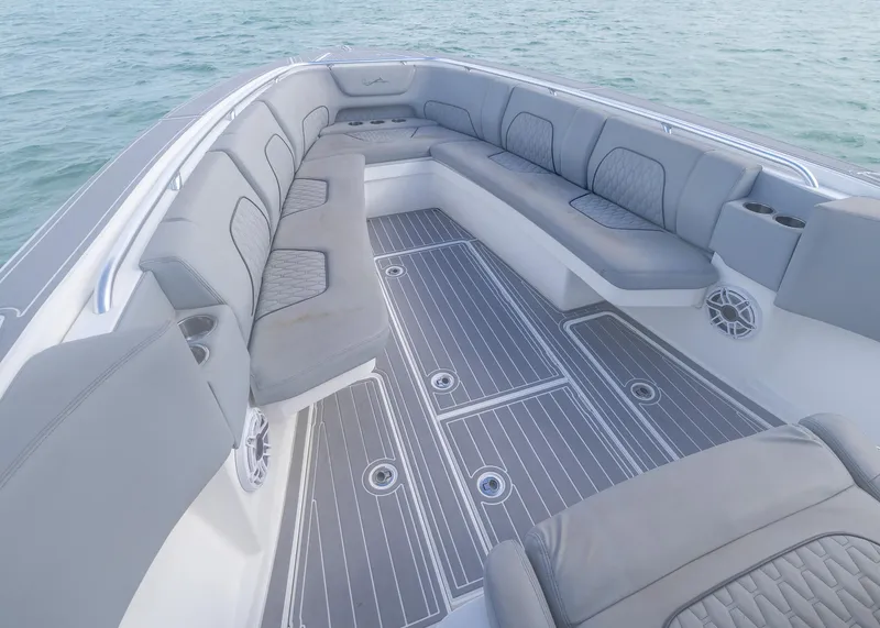 Slide: The Image of Luxurious seating area on a 2021 Blackwater 36 Sport boat, featuring sleek gray upholstery. - 5