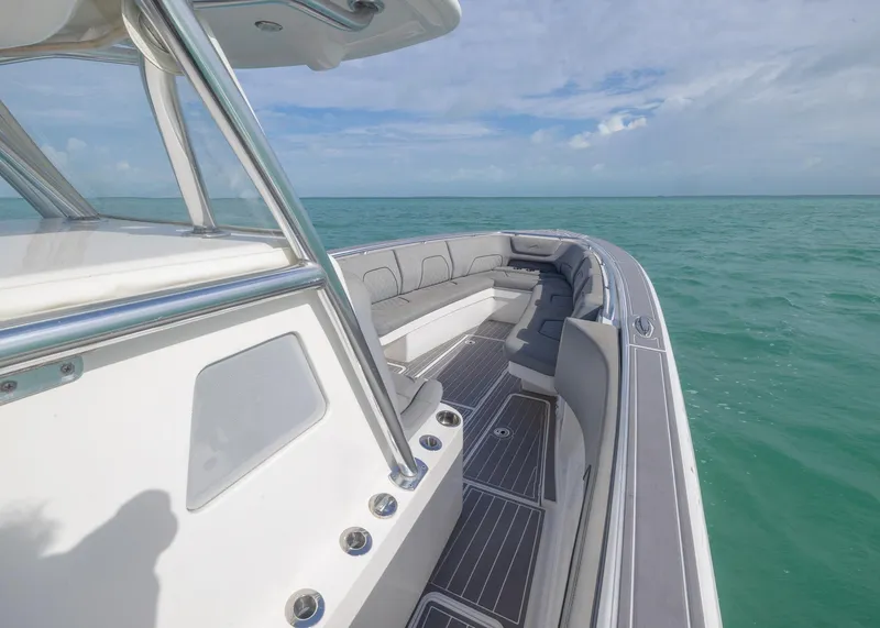 Slide: The Image of 2021 Blackwater 36 Sport boat on calm turquoise waters under a clear sky. - 9