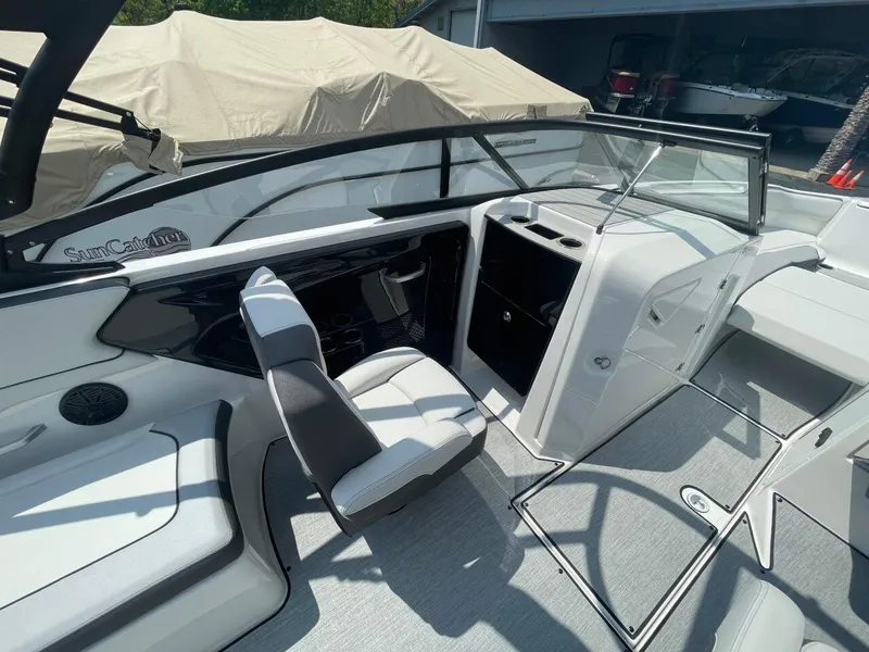 Slide: The Image of 2025 Yamaha AR250 boat interior with sleek seating and modern dashboard design. - 11