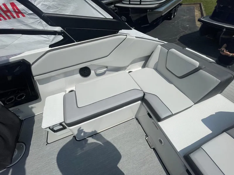 Slide: The Image of 2025 Yamaha Boats AR250 interior seating with sleek, modern design and comfortable upholstery. - 12