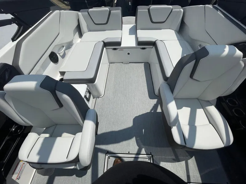 Slide: The Image of 2025 Yamaha Boats AR250 interior with white seating and modern design. - 13