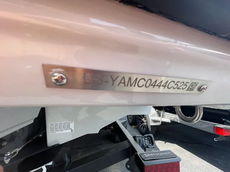 Slide: The Image of 2025 Yamaha Boats AR250 hull identification number plate on a trailer. - 24