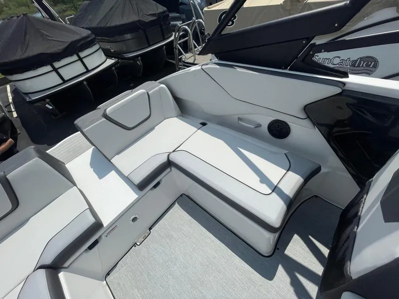 Slide: The Image of 2025 Yamaha Boats AR250 interior seating with sleek, modern design and comfortable upholstery. - 9