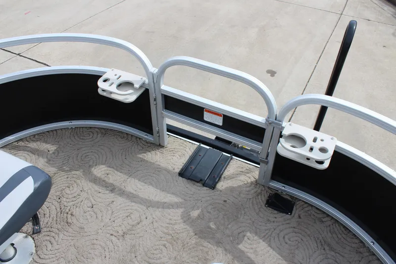 Slide: The Image of 2014 Sun Tracker Bass Buggy 18 DLX pontoon boat deck with cup holders. - 23