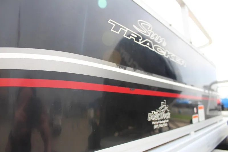 Slide: The Image of 2014 Sun Tracker Bass Buggy 18 DLX boat with sleek black and red design. - 26