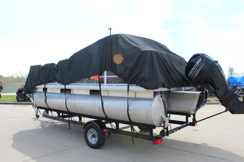 Slide: The Image of 2014 Sun Tracker Bass Buggy 18 DLX pontoon boat covered on trailer. - 30