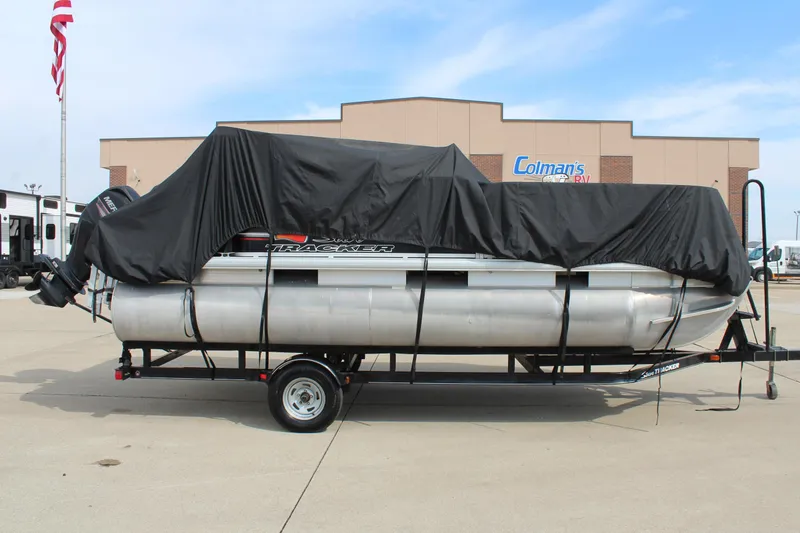 Slide: The Image of 2014 Sun Tracker Bass Buggy 18 DLX pontoon boat covered on trailer. - 32