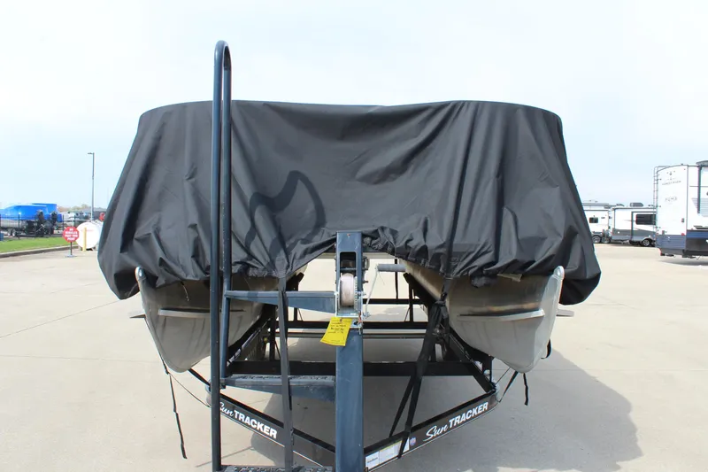 Slide: The Image of 2014 Sun Tracker Bass Buggy 18 DLX pontoon boat covered on trailer. - 34