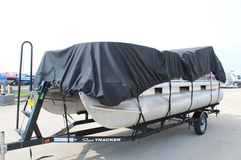 Slide: The Image of 2014 Sun Tracker Bass Buggy 18 DLX pontoon boat covered on trailer. - 36
