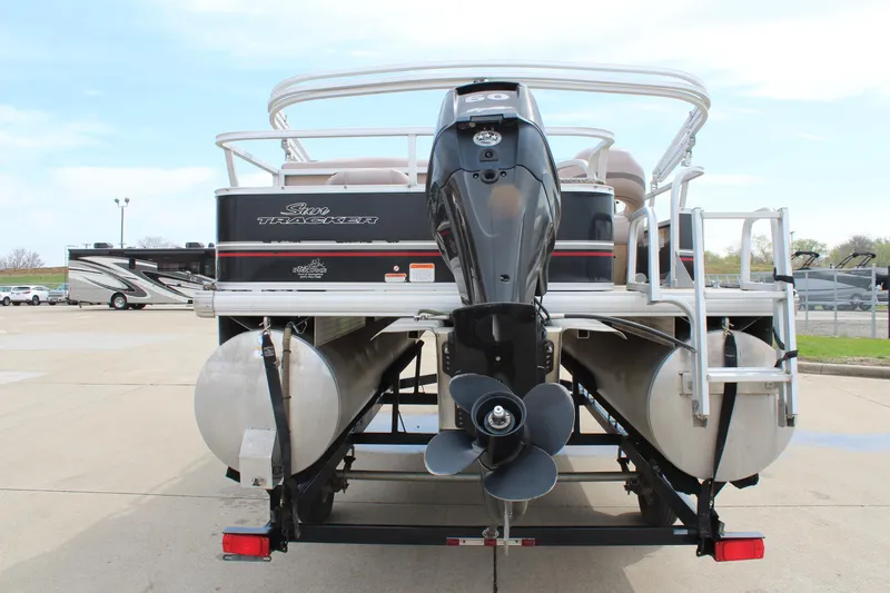 Slide: The Image of 2014 Sun Tracker Bass Buggy 18 DLX pontoon boat, rear view with motor and trailer. - 6