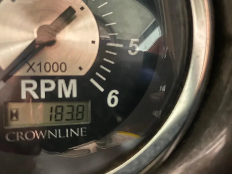 Slide: The Image of Close-up of a 2012 Crownline 21 SS RPM gauge displaying 193.8 hours. - 15
