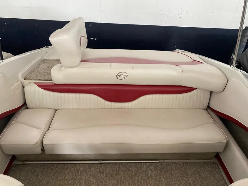 Slide: The Image of 2012 Crownline 21 SS boat interior with beige and red seating. - 8