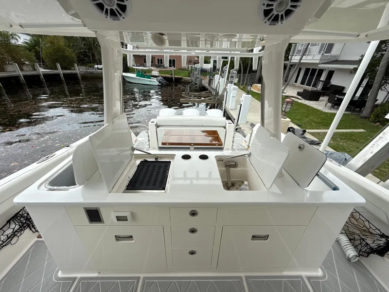 Slide: The Image of 2021 Regal 38 SAV boat with outdoor kitchen and grill setup. - 11